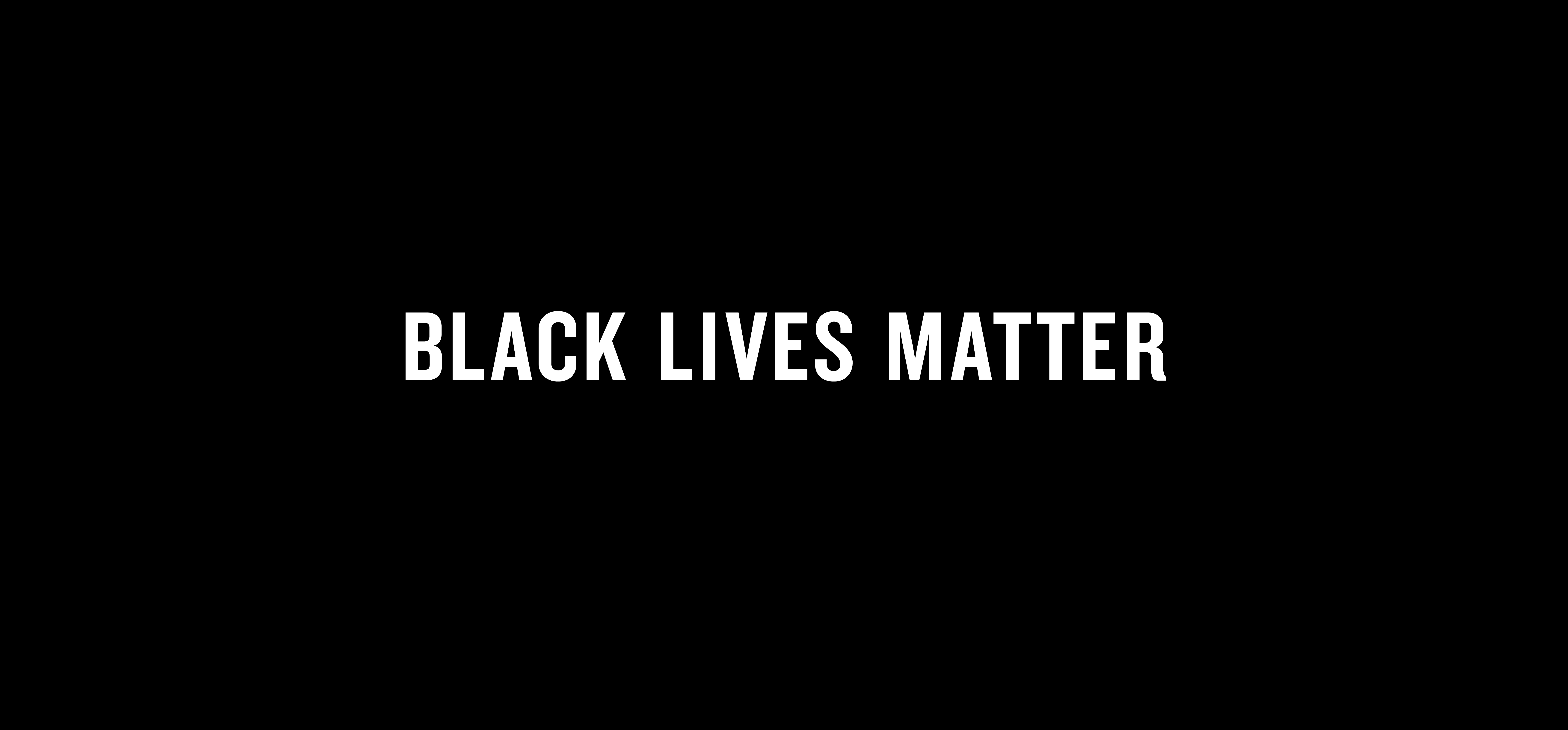 A black background with bold, white, all-caps text centered in the image that reads “BLACK LIVES MATTER.”