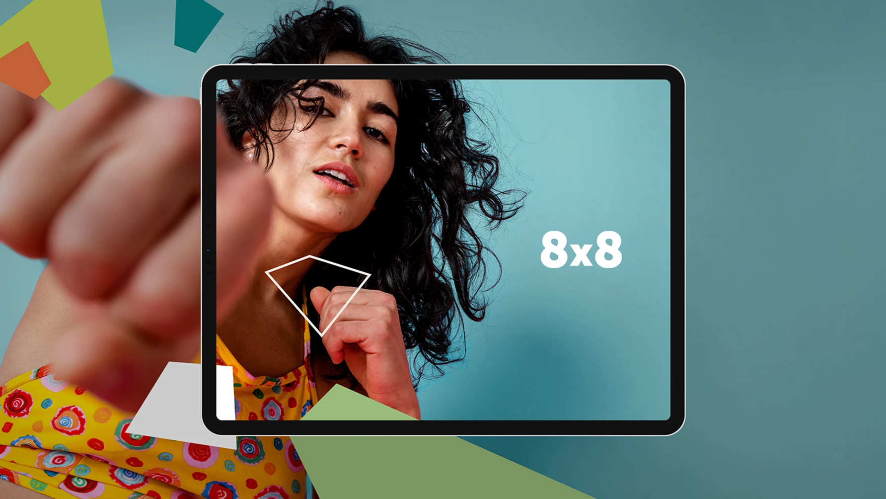 Woman in a colorful top punches toward the camera, with her image partially framed inside a digital tablet displaying the 8x8 company logo on a blue background; abstract geometric shapes surround the composition.