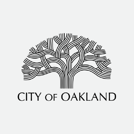 Logo of the City of Oakland. The image features a stylized oak tree composed of interwoven, curved black lines forming the trunk and branches. Beneath the tree, the text reads "CITY OF OAKLAND" in bold, uppercase letters.